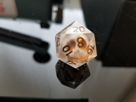 What is the difference between handpoured and handmade dice?