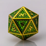 Dragon Scale, green and gold metal DND dice D20 on a white background.