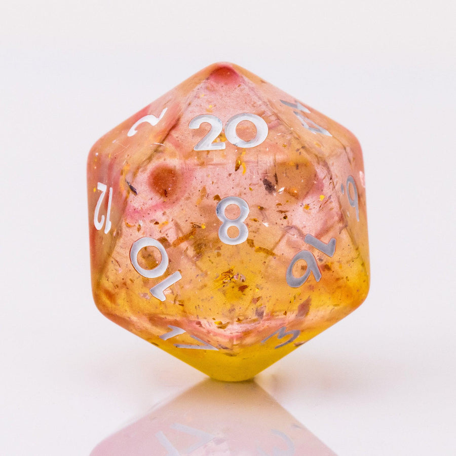 Dreamsicle, rose gold and orange d20 on a white background.