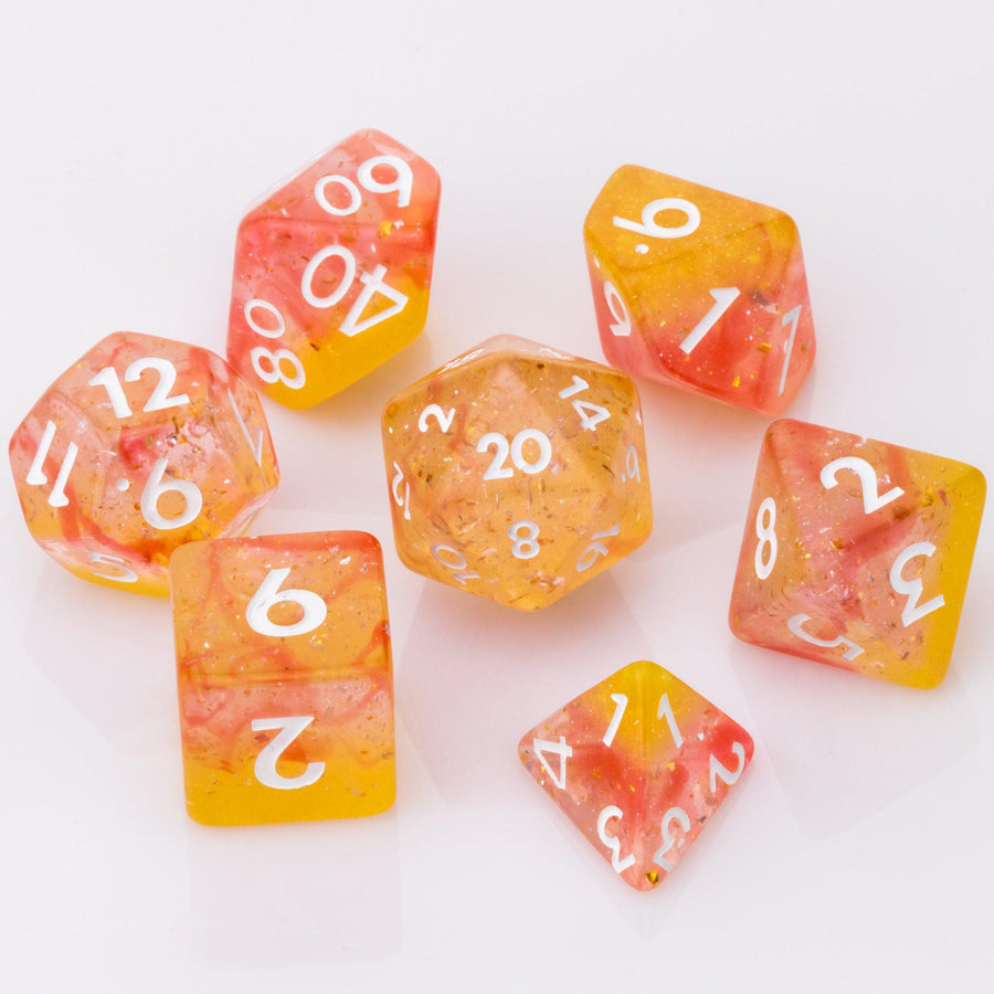 Dreamsicle, rose gold and orange dnd dice set on a white background.