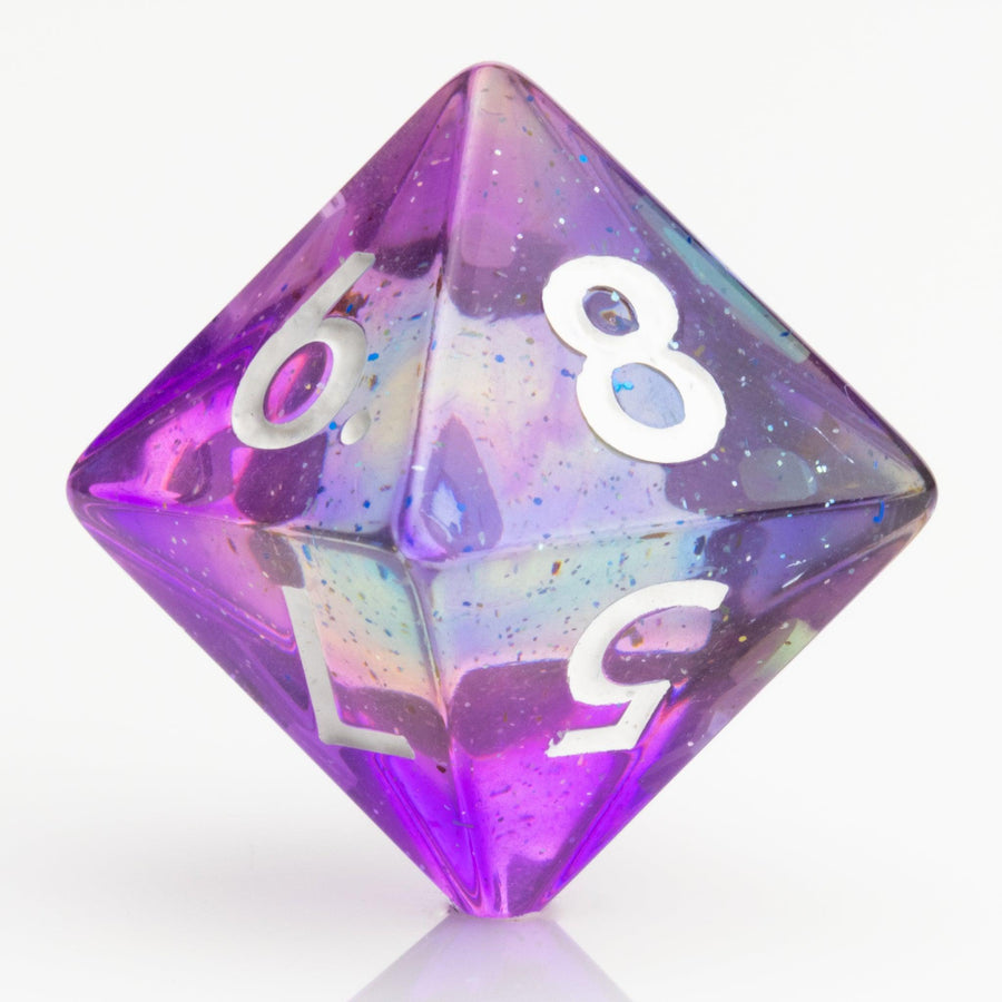 Sakura Sunset, translucent blue and purple 7 piece resin RPG dice set D8 on white background.