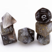 Sandstorm, swirling 7 piece DND dice set stacked on white background.