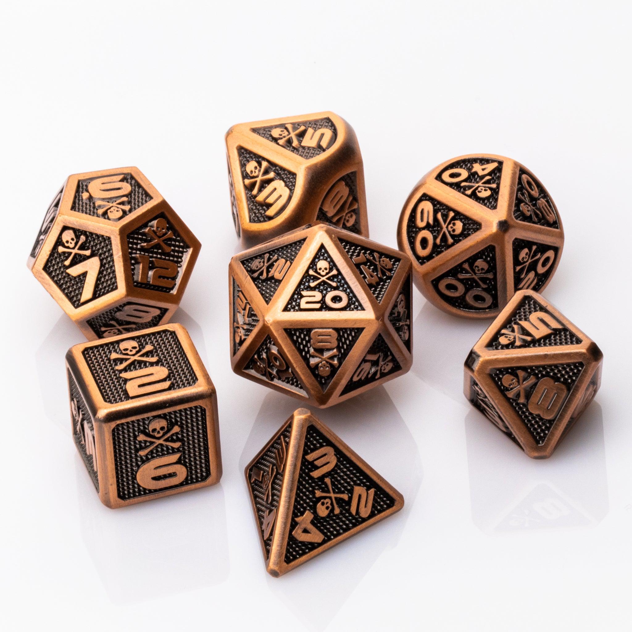 Skullsmash, Copper colored metal RPG dice set with skull and crossbones on a white background.