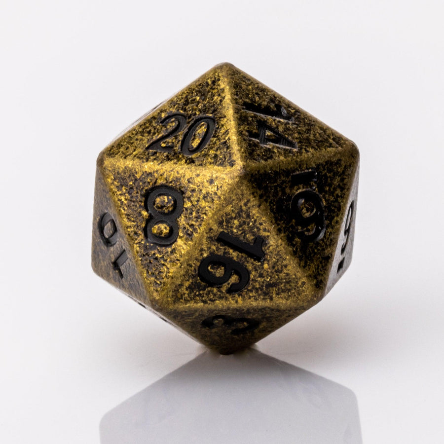 Thunk, weathered bronze colored metal DND dice D20 on a white background.
