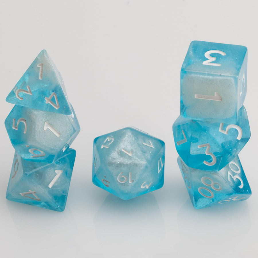 Winter's Breath, frosted blue and white 7 piece RPG dice set stacked on a white background.