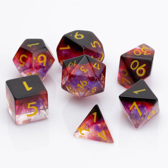 Blood Moon, dripping red, purple and clear 7 piece DND  dice set on a white background.