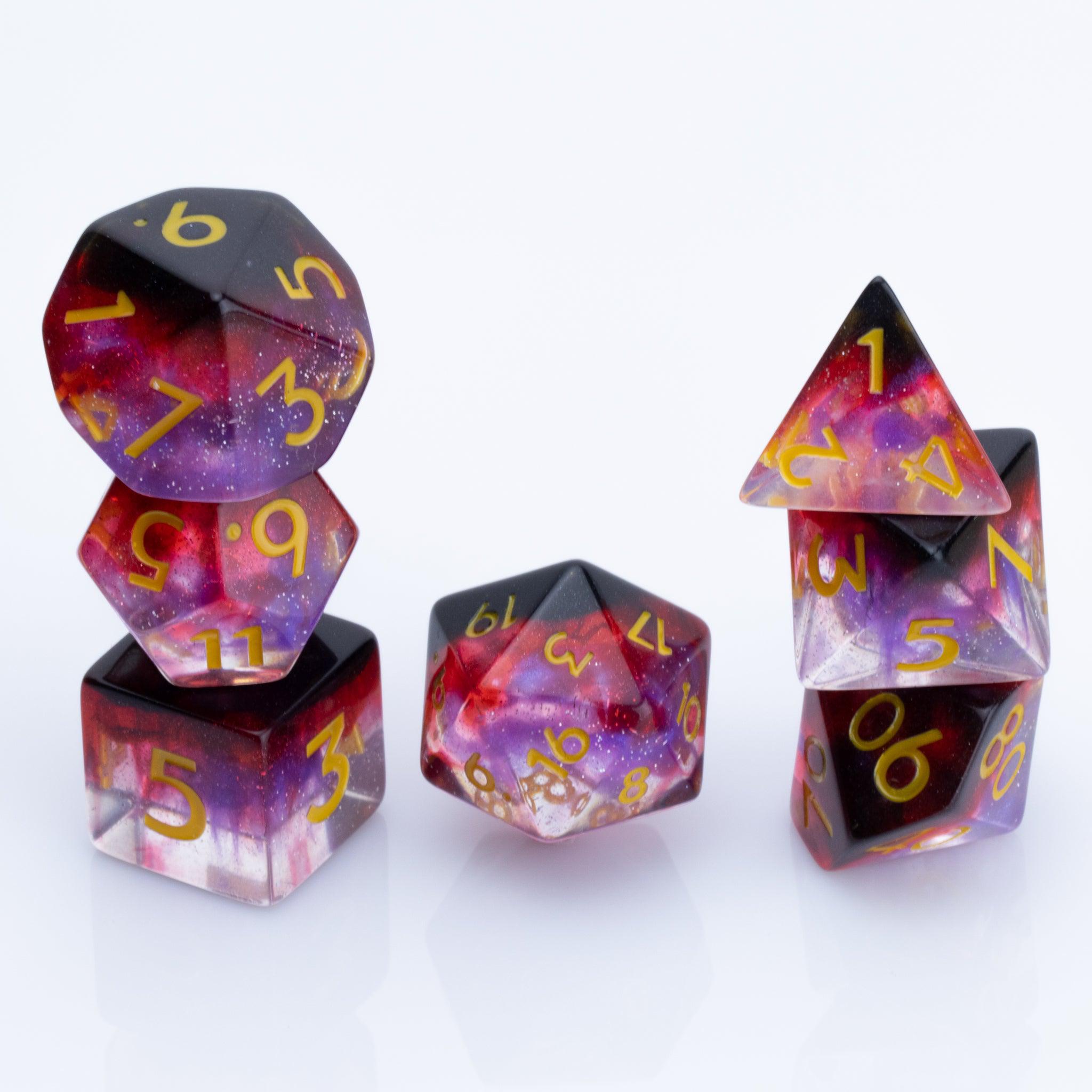 Blood Moon, dripping red, purple and clear 7 piece DND dice set stacked on a white background.