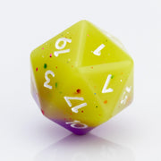 Cupcakes yellow & purple 7 piece RPG dice set D20 on a white background.