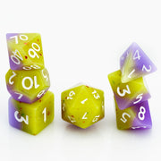 Cupcakes yellow & purple 7 piece RPG dice set stacked on a white background.