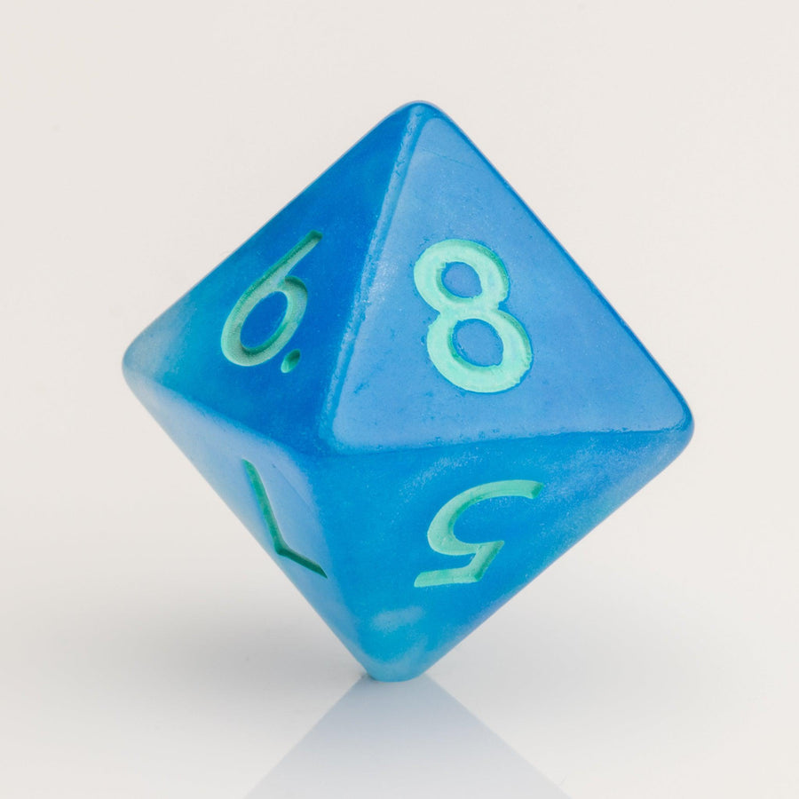 Infinite, cloudy blue dice with glittery inclusions and teal numbering. D8 on white background.