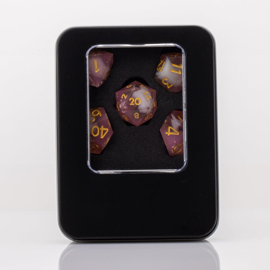 Lavendar Haze, pink and white handmade DND dice set in decorative tin on a white background.