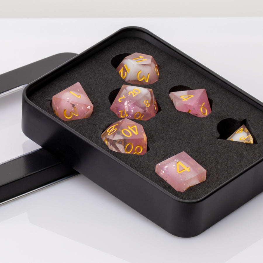 Lavendar Haze, pink and white handmade DND dice set in decorative tin on a white background.