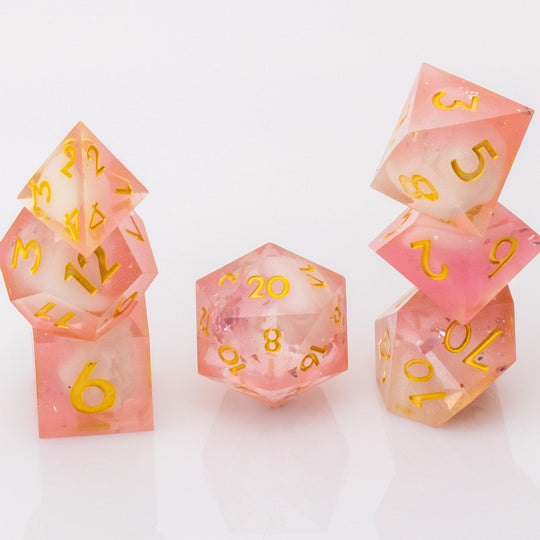 Lavendar Haze, pink and white handmade DND dice set stacked on a white background.