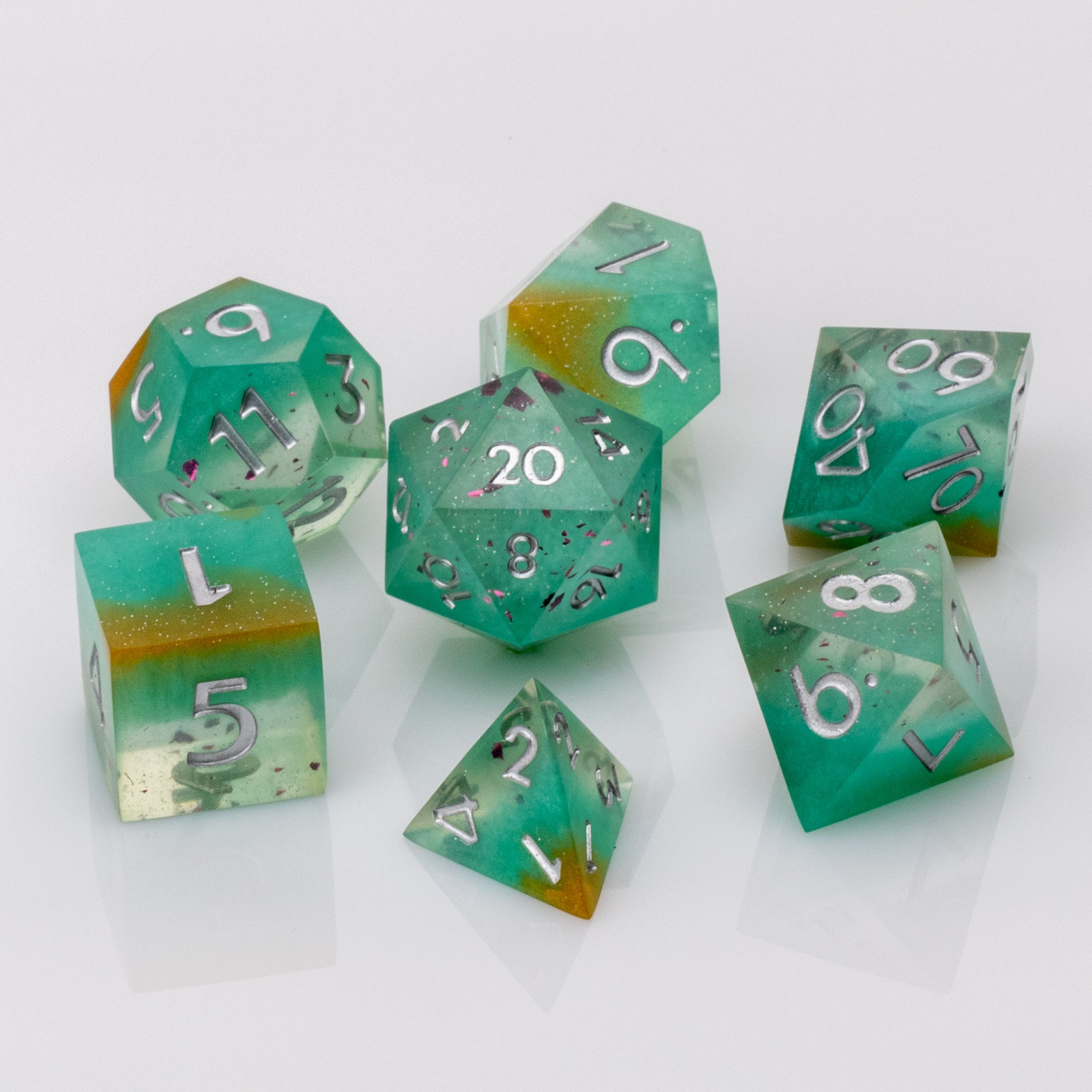 Mojito, green handmade resin DND dice set on white background.