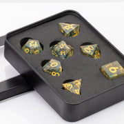 Moonlight, gold and blue handmade RPG dice set in decorative tin on a white background.