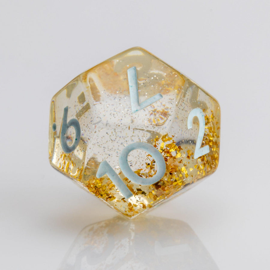 Myst--Translucent DND dice with layered gold flake inclusions. D12 on white background.