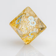 Myst--Translucent DND dice with layered gold flake inclusions. D8 on white background.