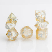 Myst--Translucent DND dice with layered gold flake inclusions. 7 piece DND dice set stacked on white background.