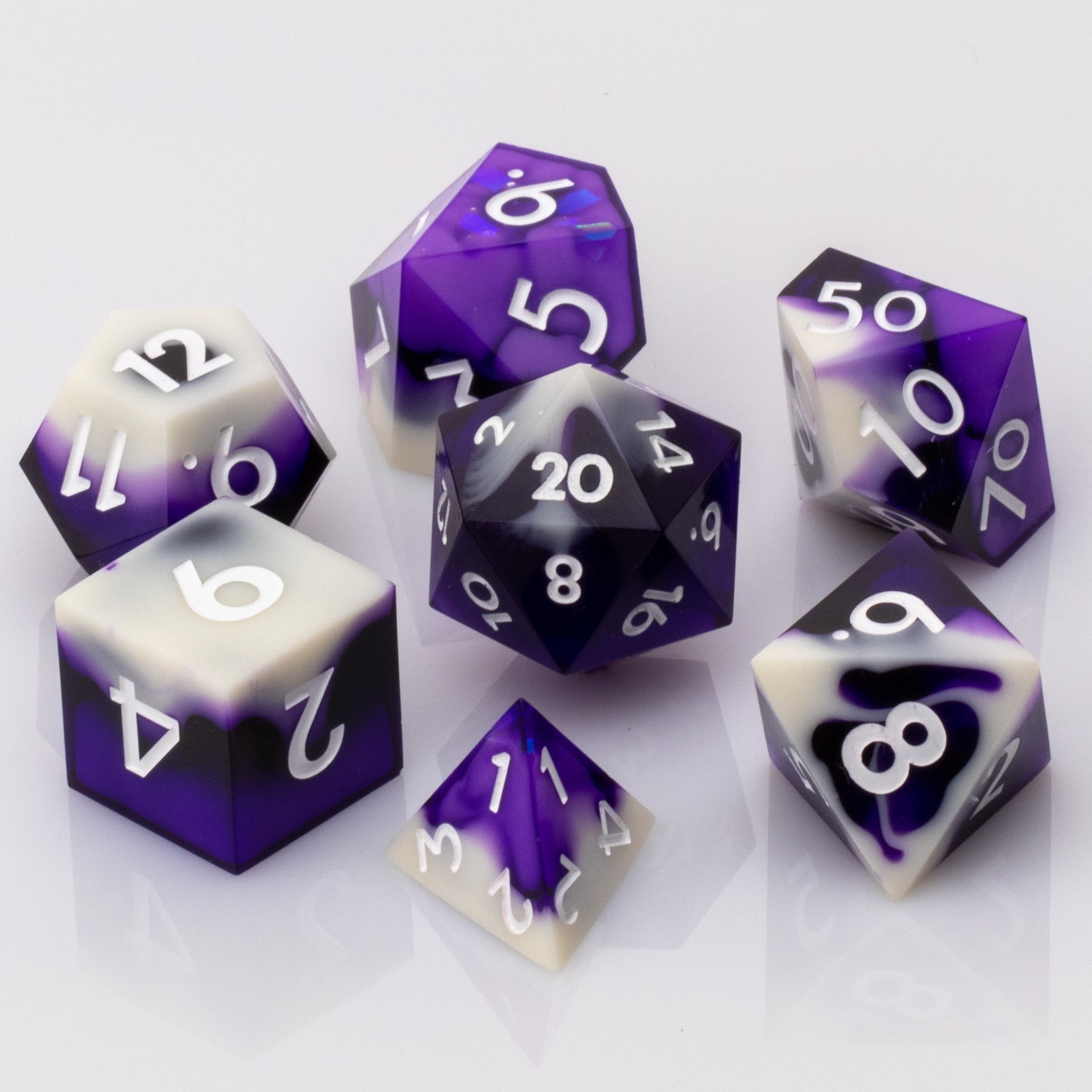 Nightfall, purple and white handmade DND dice set on a white background.
