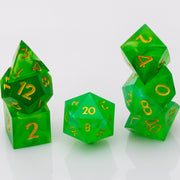 Nirvana, swirling green handmade RPG dice set stacked on a white background.