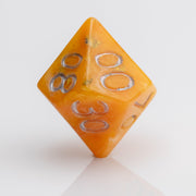Orcana--Orange swirled RPG dice with gold metallic inking. D00 on white background.