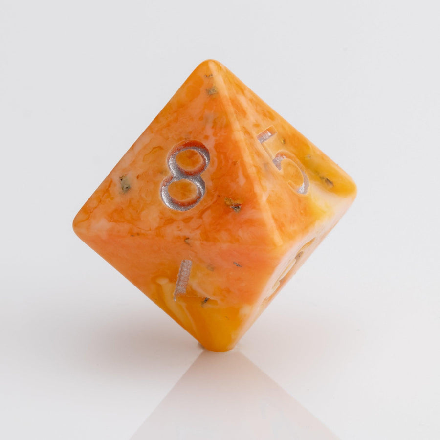 Orcana--Orange swirled RPG dice with gold metallic inking. D8 on white background.