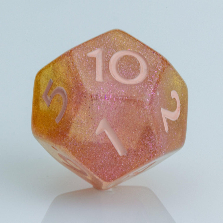 Pamplemousse, pink & orange gold D12 on a white background.