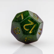 Perseid--Green and purple RPG dice with with swirled, glittery inclusions and gold metallic inking. D12 on white background.
