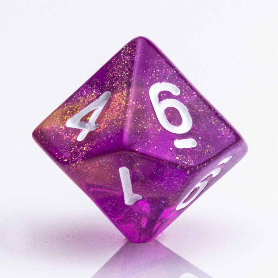 Rainbow Sherbet, purple and yellow gold translucent RPG dice with wite inking. 7 piece RPG dice set D10 on white background.