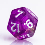 Rainbow Sherbet, purple and yellow gold translucent RPG dice with wite inking. 7 piece RPG dice set D12 on white background.