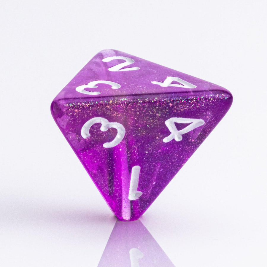 Rainbow Sherbet, purple and yellow gold translucent RPG dice with wite inking. 7 piece RPG dice set D4 on white background.