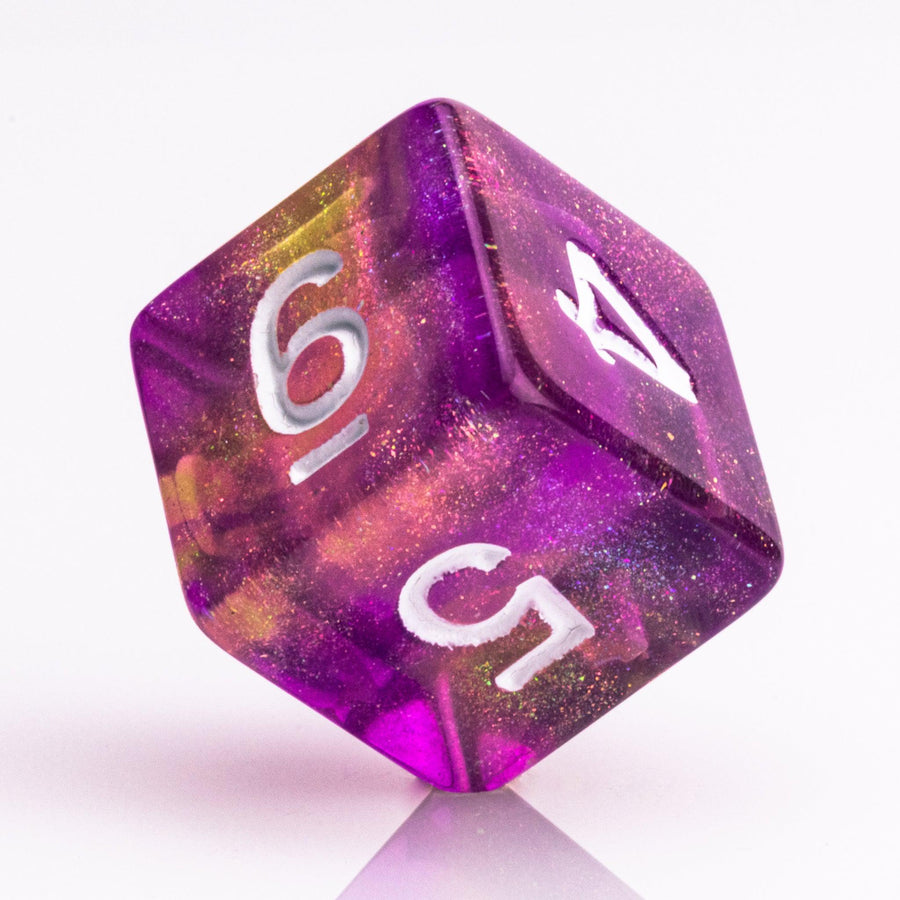 Rainbow Sherbet, purple and yellow gold translucent RPG dice with wite inking. 7 piece RPG dice set D6 on white background.