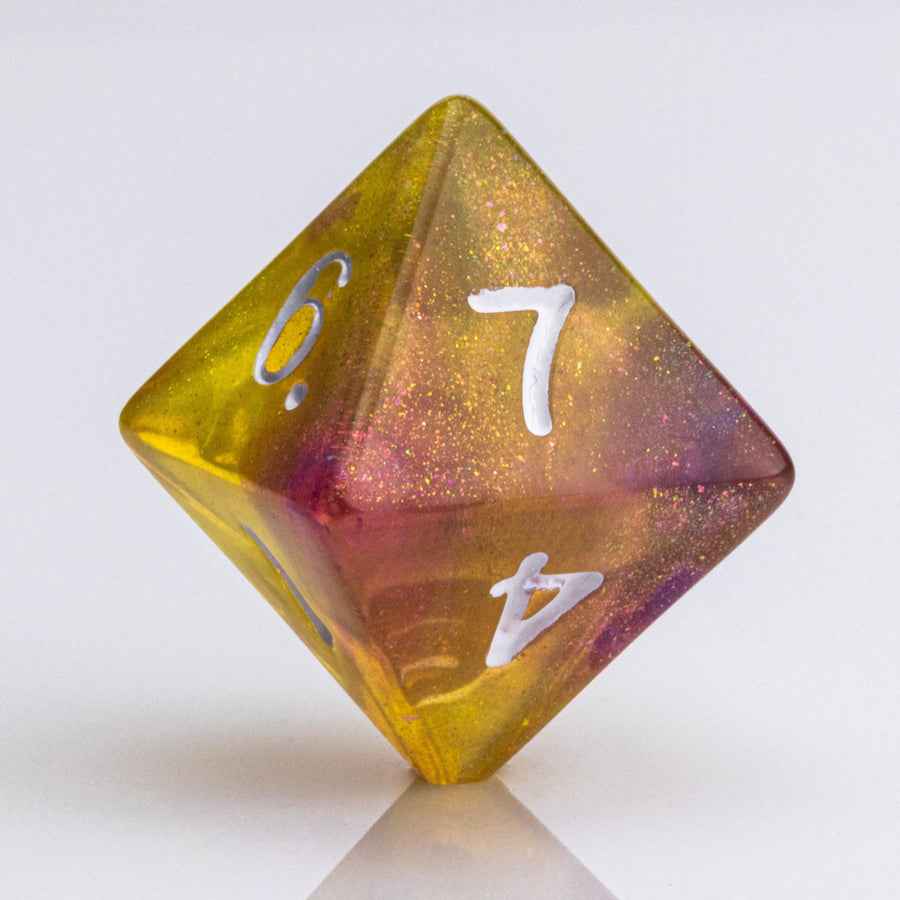 Rainbow Sherbet, purple and yellow gold translucent RPG dice with wite inking. 7 piece RPG dice set D8 on white background.