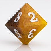 Scorch, yellow, brown and black resin DND dice 7 piece set D8 on white background.