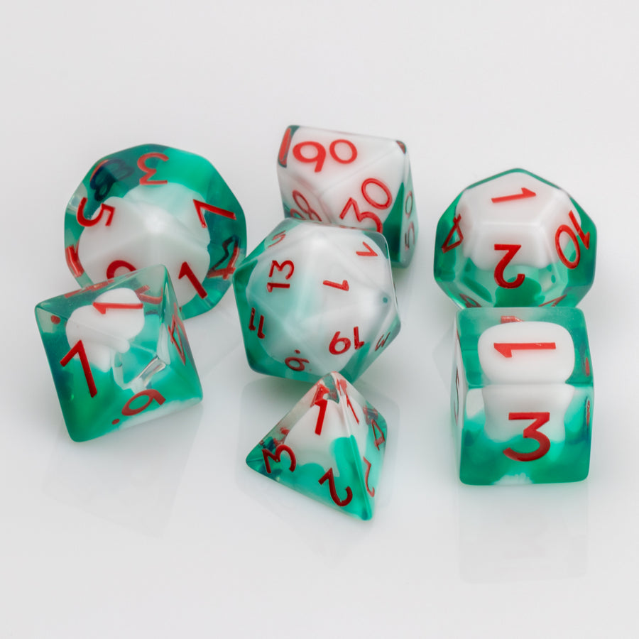 Shillelagh, white, green, and red RPG dice set on a white background.