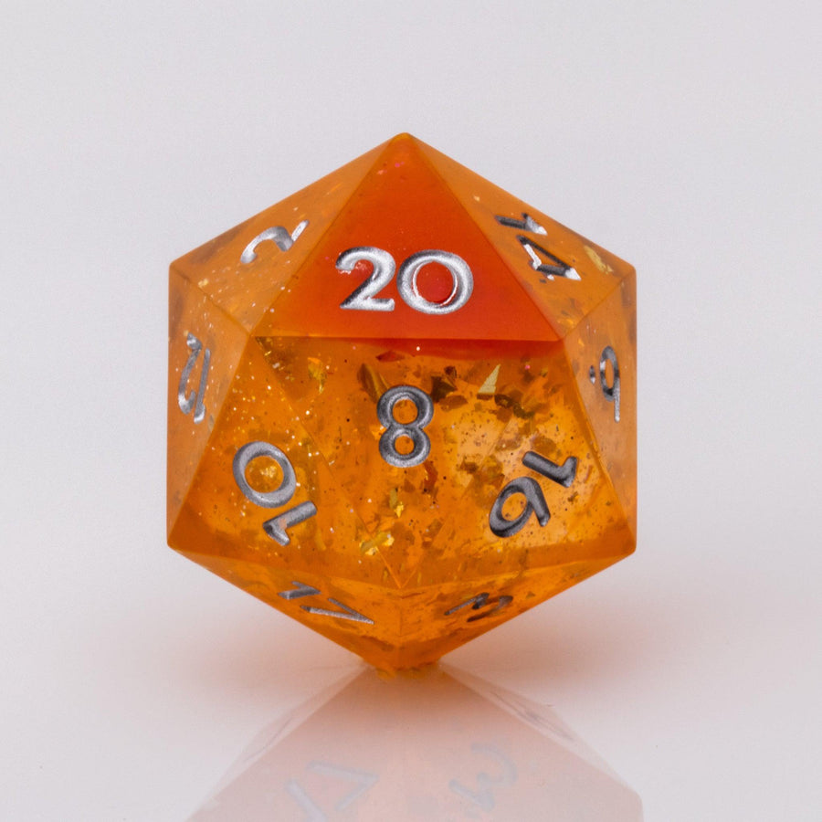 Sunfire, swirling orange and red handmade DND dice D20 on a white background.